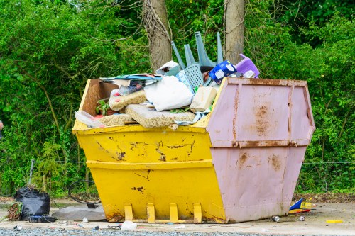 Residents arranging furniture for disposal in Watford